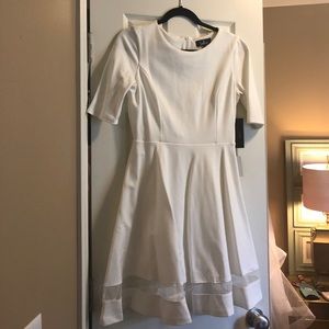 White skater dress with mesh detail on bottom